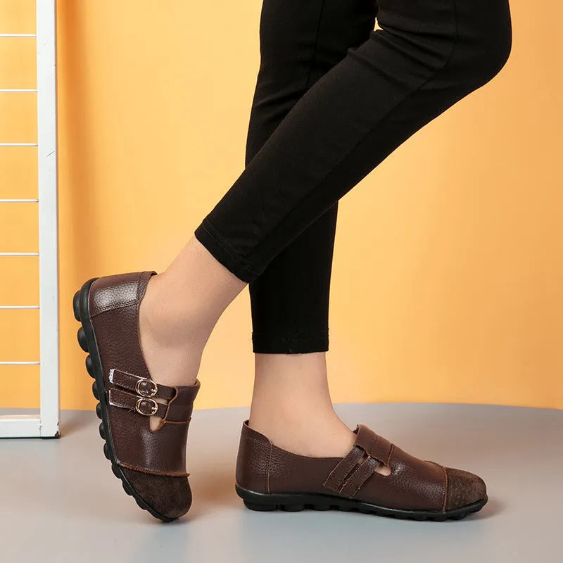 Women's low-top casual shoes in black with Velcro strap and rounded toe, showcasing cow split leather upper and beef tendon sole.