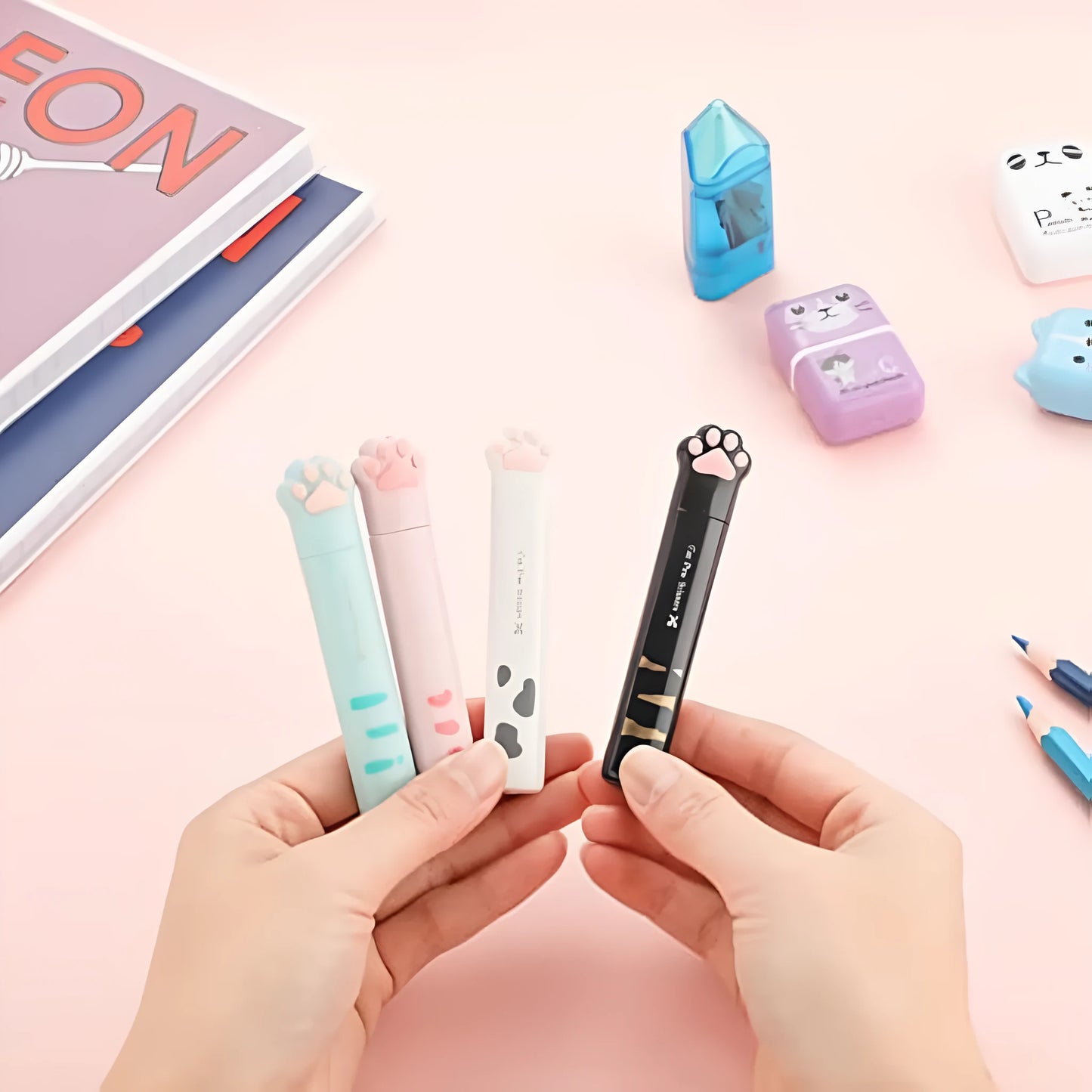 Closed and open views of cat paw mini folding scissors showing stainless steel blades and coloured handles.