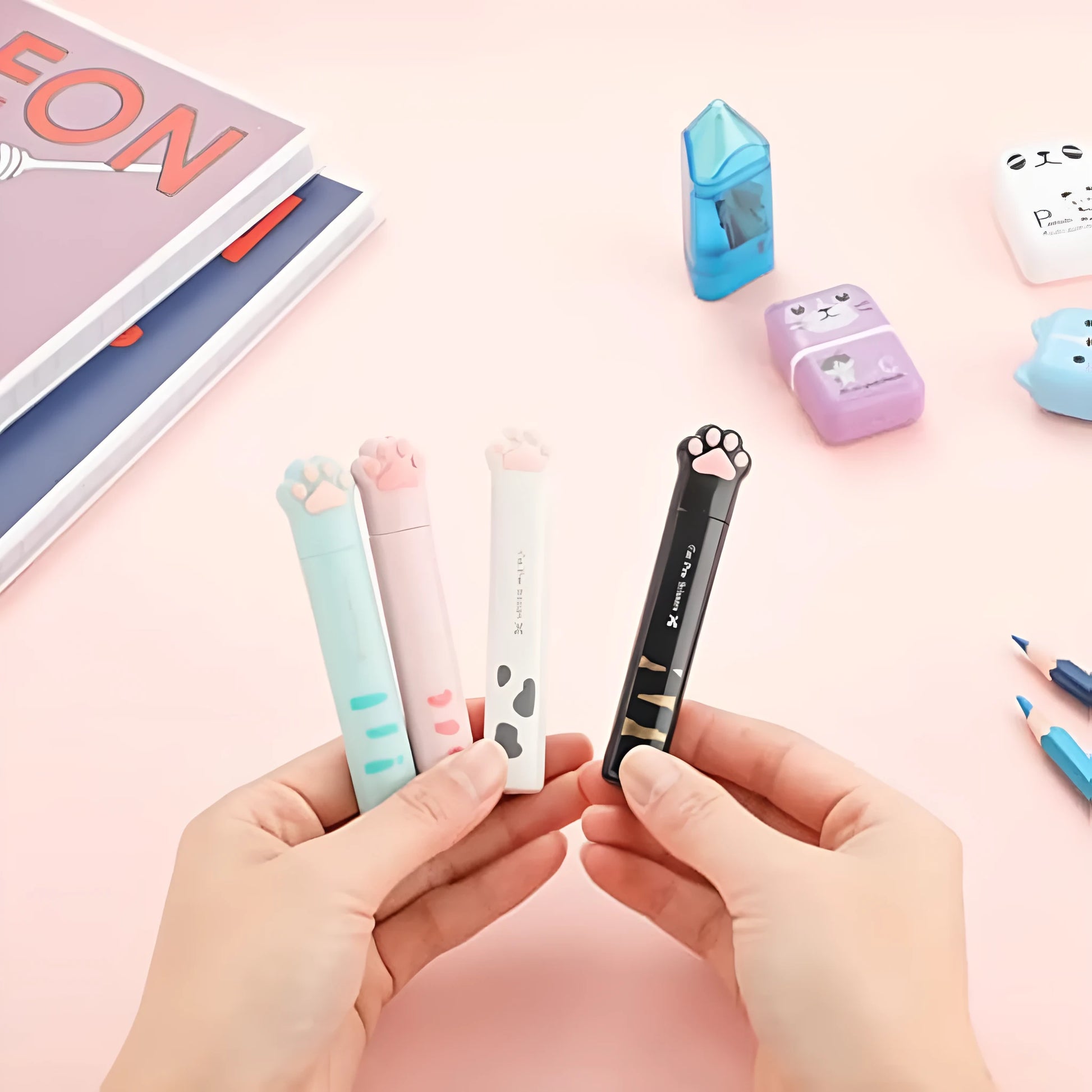 Closed and open views of cat paw mini folding scissors showing stainless steel blades and coloured handles.
