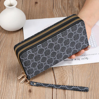 Long black retro-style PU leather wallet clutch with a printed pattern, showing a mobile phone pocket and a zippered coin purse.