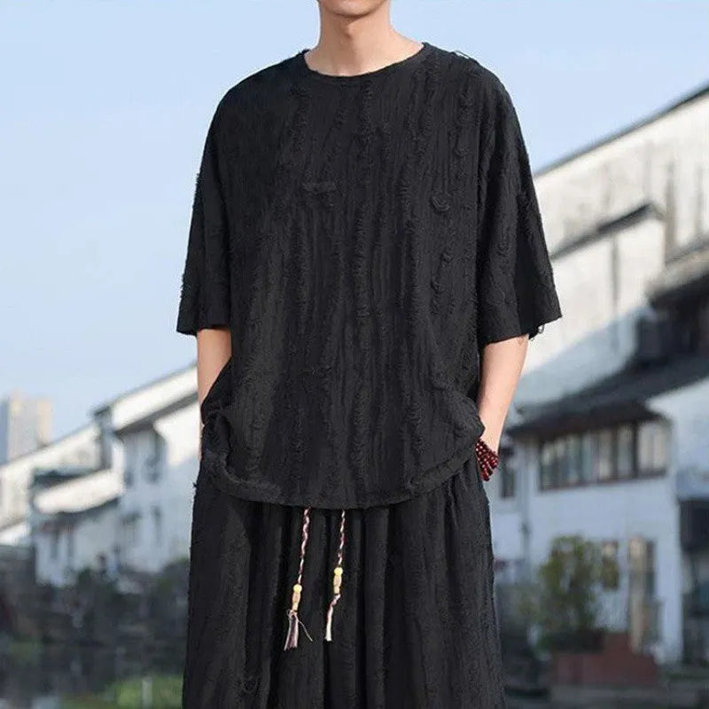 Men's black and grey knitted short-sleeve top with matching loose cropped trousers casual suit set
