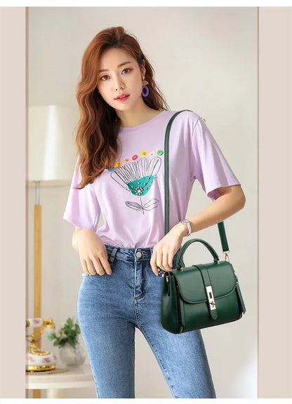 Women's soft black PU leather vertical messenger bag with adjustable strap, showing interior polyester lining.