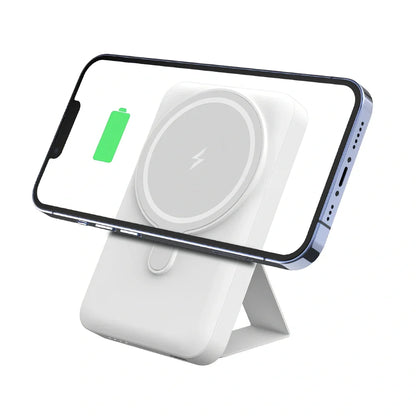 White Magsafe magnetic power bank showing magnetic charging side and USB ports