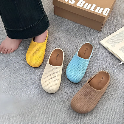 Women's non-slip cloth slippers with rubber sole in beige colour showing round toe design