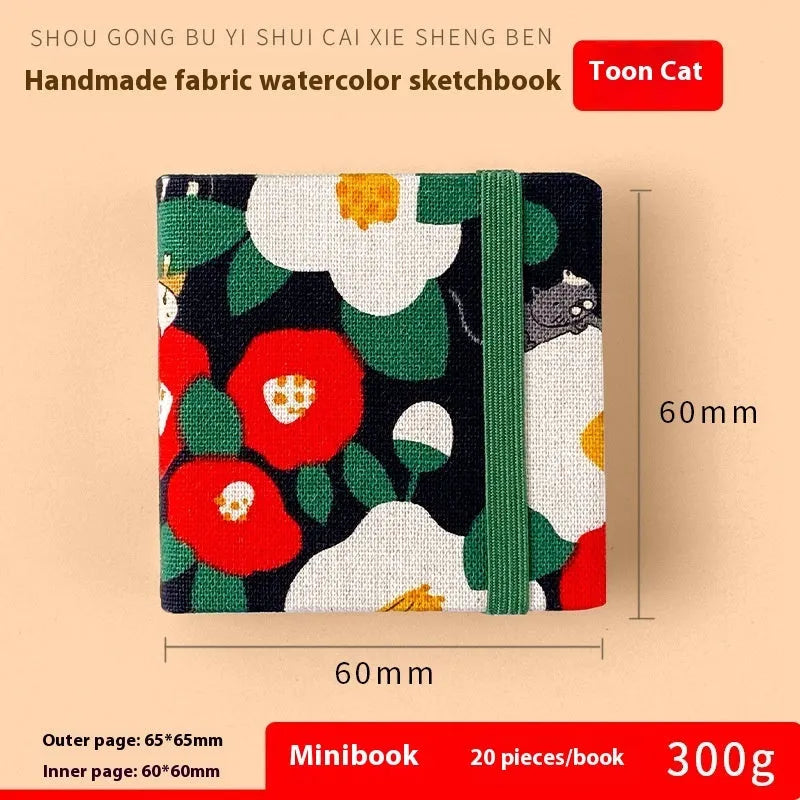 Feiluniao watercolour notebook with fabric cover, 185mm length, open to show paper for painting.