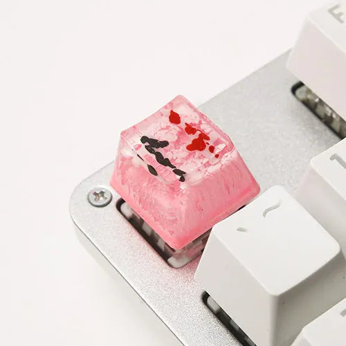 Close-up of a custom resin keycap featuring a detailed blue and orange koi fish scene, designed for Cherry MX mechanical keyboards.