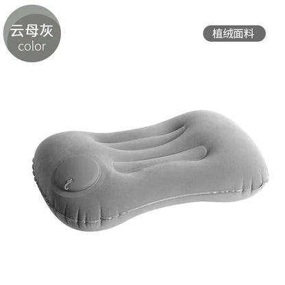 Grey inflatable travel pillow with flocking surface, shown deflated and inflated to 45x30x13cm size.