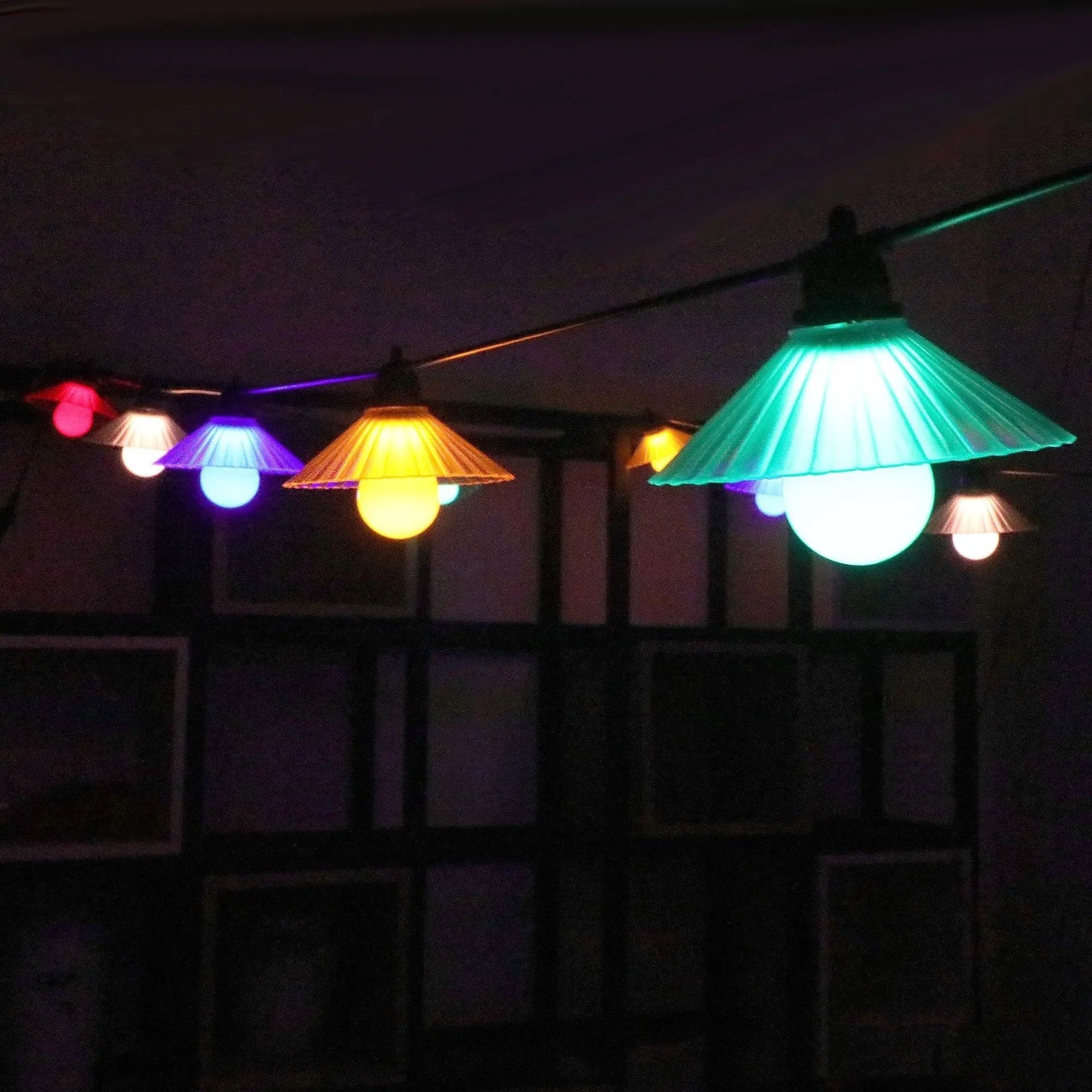 Outdoor LED string lights with flower-shaped bulbs in warm white or multicolour options