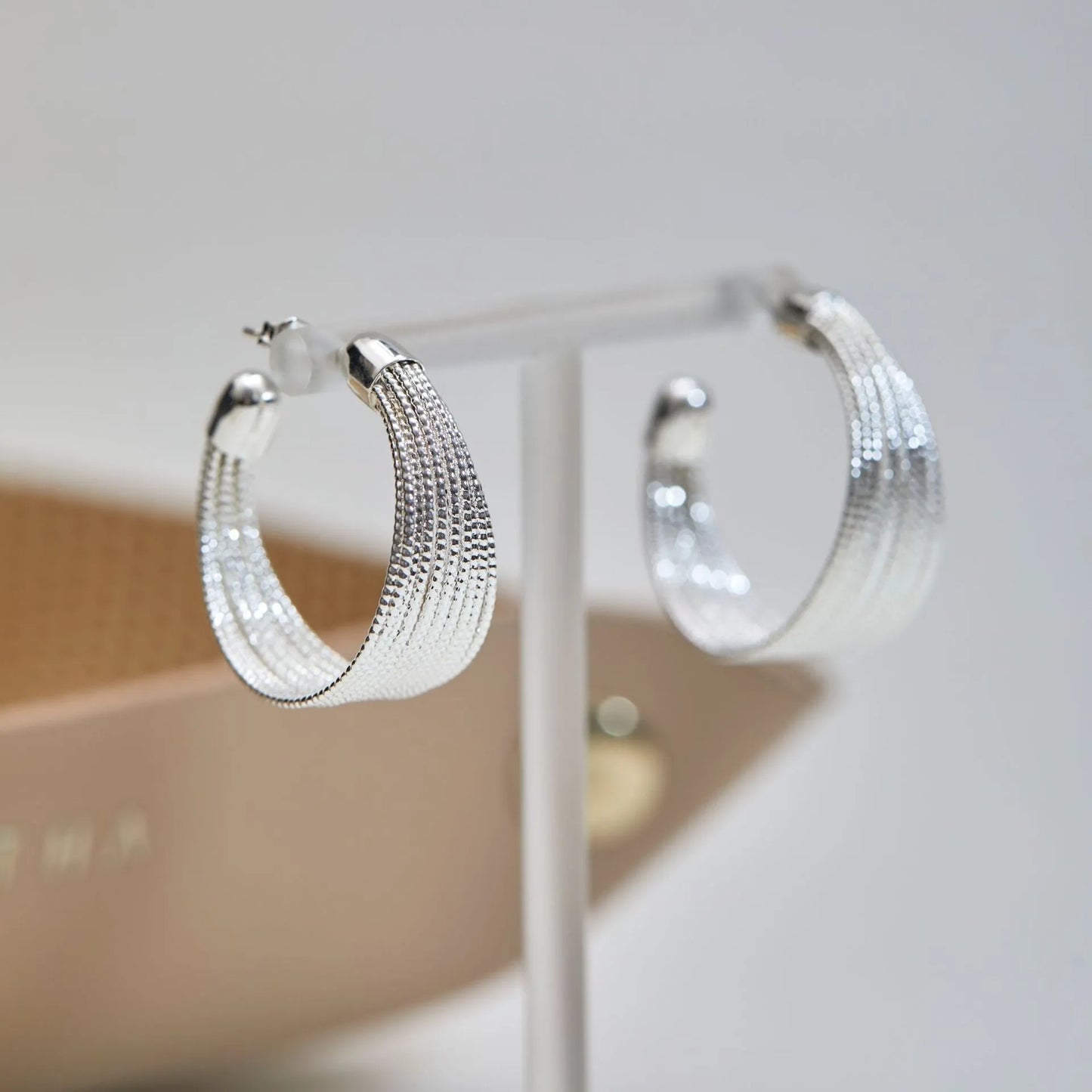 Geometric copper earrings set with gold and silver electroplated finish showing clip and stud options
