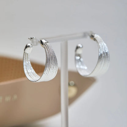 Geometric copper earrings set with gold and silver electroplated finish showing clip and stud options
