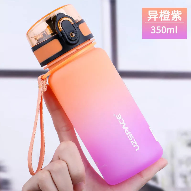 Large capacity Tritan sports water bottle in vibrant colors, perfect for hydration on the go