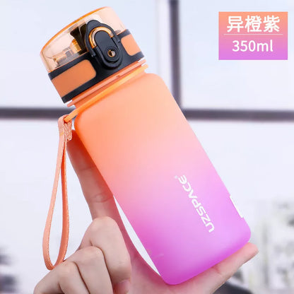 Large capacity Tritan sports water bottle in vibrant colors, perfect for hydration on the go