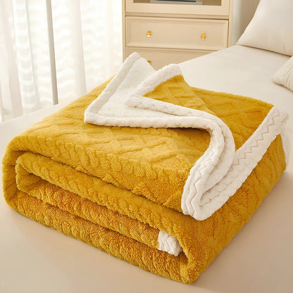 Double-thickened coral fleece sofa blanket in caramel colour showing dense texture and substantial thickness