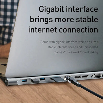 Grey aluminium alloy ten-port docking station with cooling bracket showing HDMI, VGA and USB ports