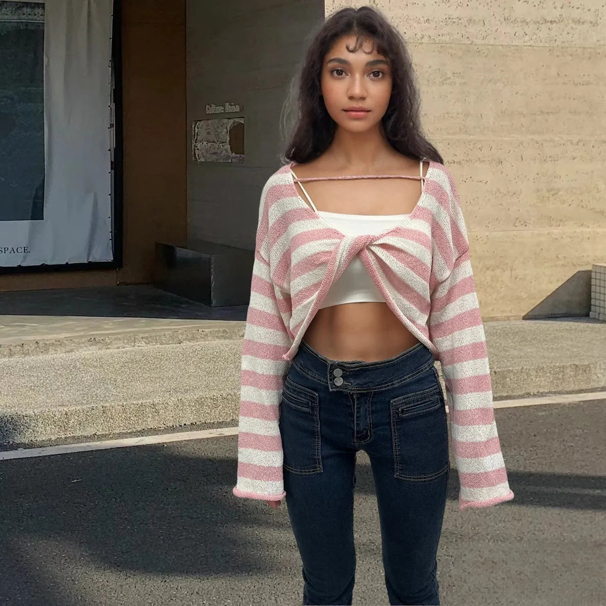 Reversible black and white striped cropped sweater shown worn both front and back.