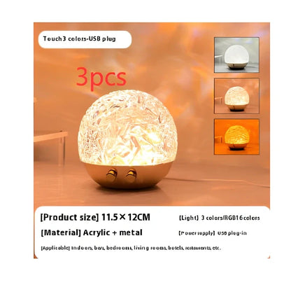 Spherical water ripple projector night light with touch controls creating colourful aurora patterns on wall