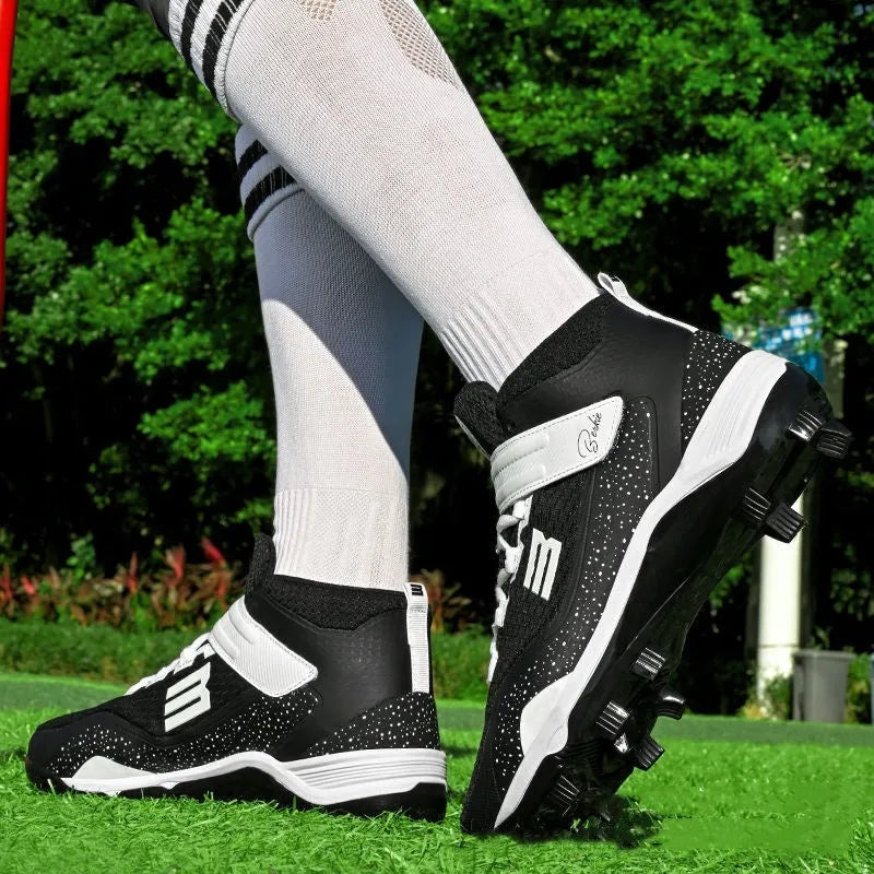 Black and white mid-top sneakers with Velcro closure and rubber soles for softball training