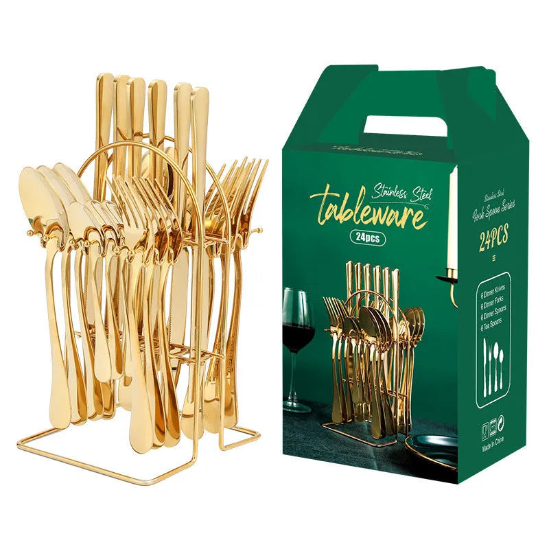 24-piece stainless steel cutlery set with knives, forks, spoons, and teaspoons on a storage rack in a gold finish.