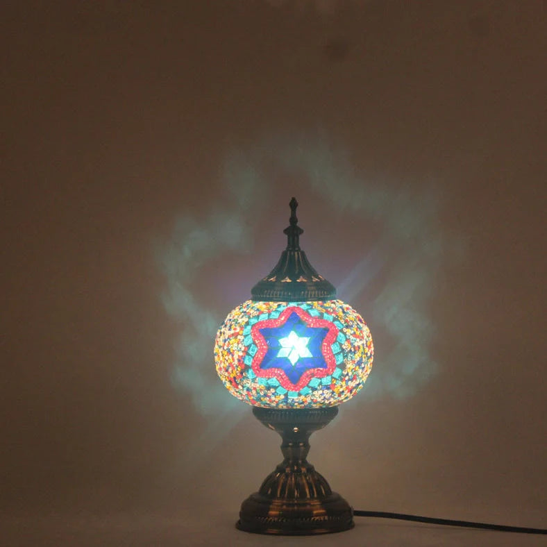 Glass table lamp with 150mm diameter shade and 330cm cord on wooden surface