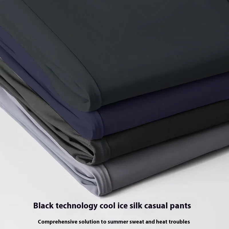 Men's black Ice Silk straight leg leisure trousers with elastic waistband laid flat