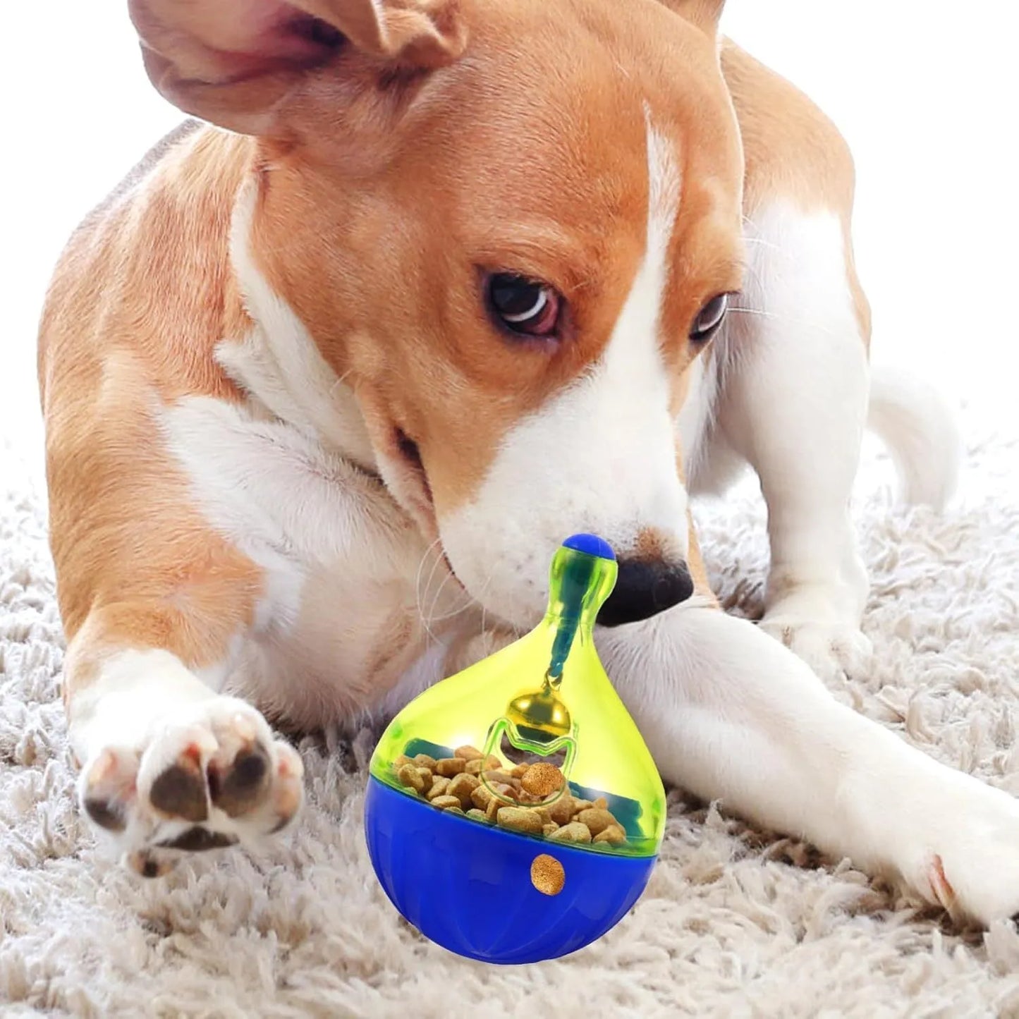 Tumbler-shaped pet treat dispenser measuring 14cm with food-leaking openings for slow feeding