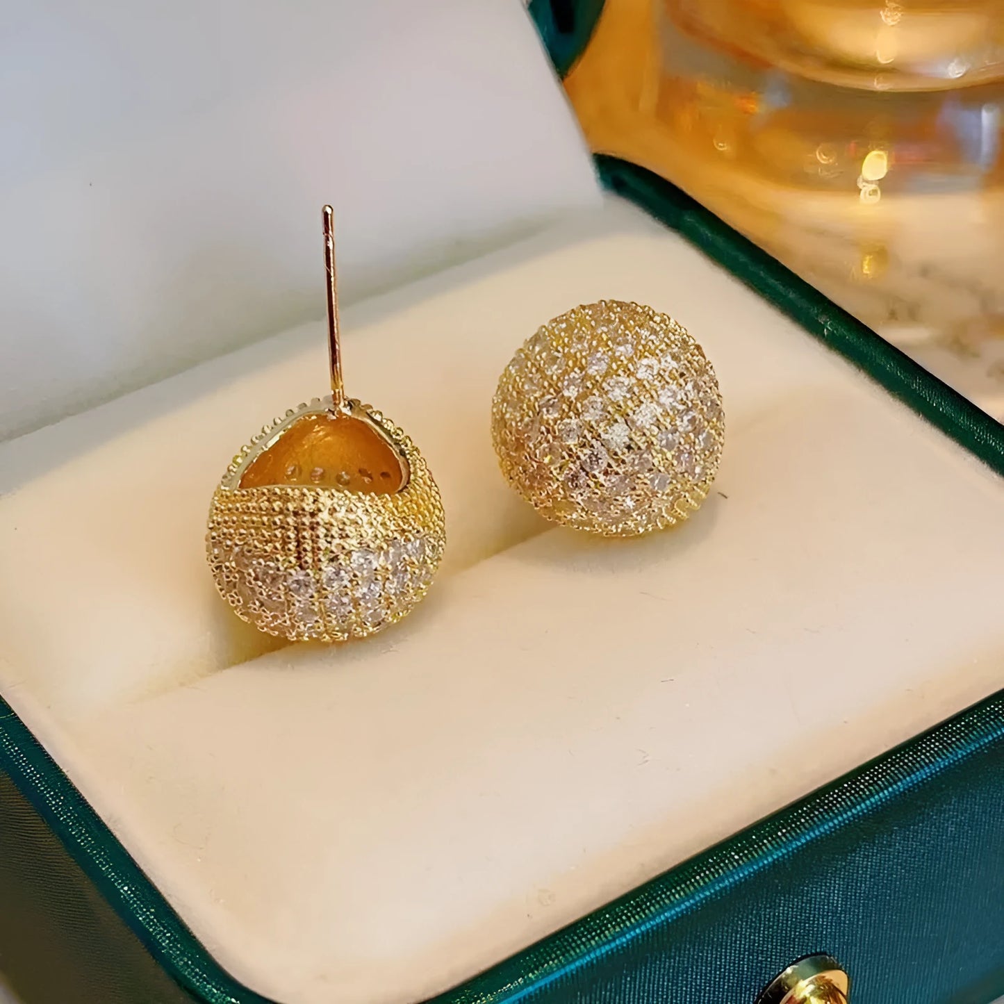 Geometric drop-shaped ear clips with full diamond design in gold or white colour options