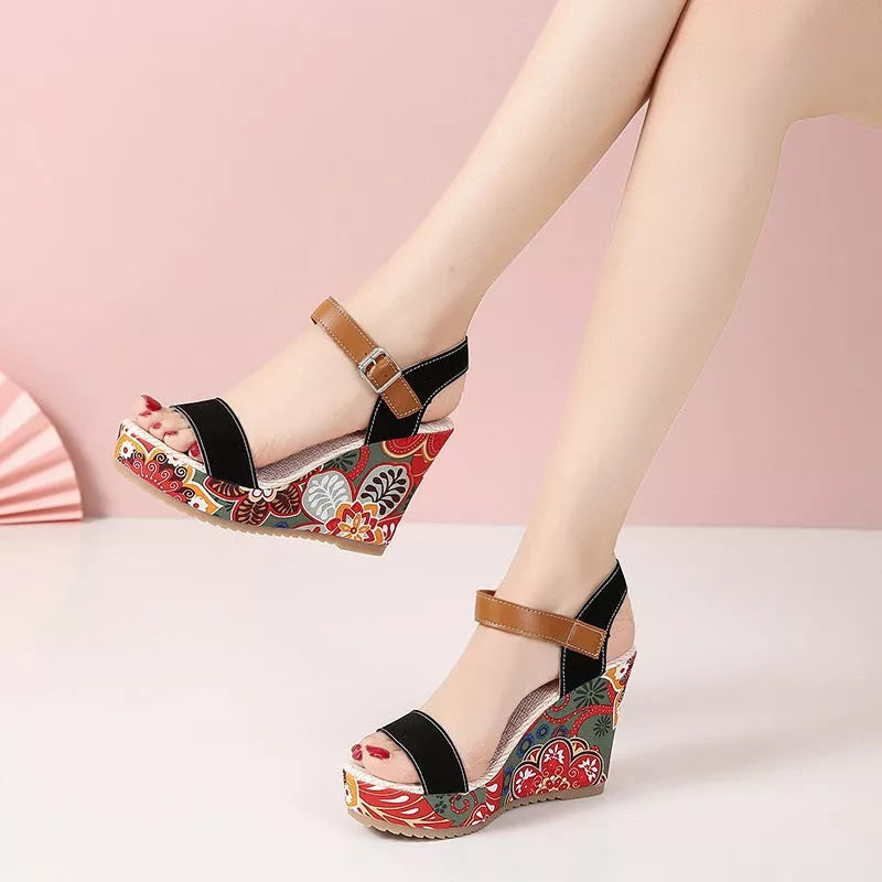 Women's floral embroidered high wedge sandals with buckle strap in black, green, and orange