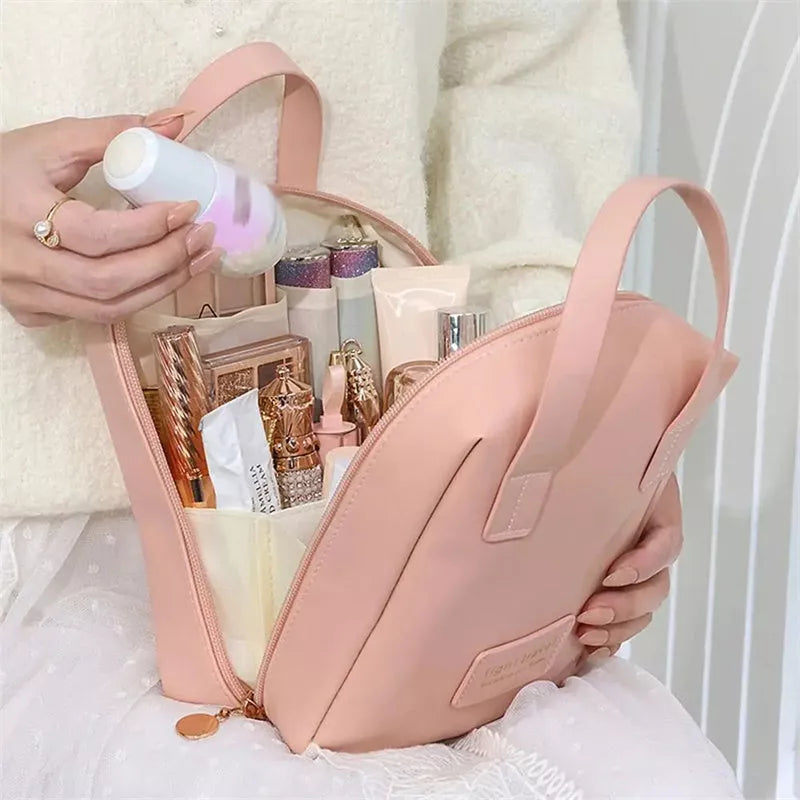 Shell-shaped waterproof PU leather cosmetic bag in various colors