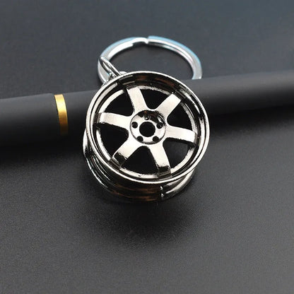 Zinc alloy car wheel hub keychain in black, gold and silver colour options