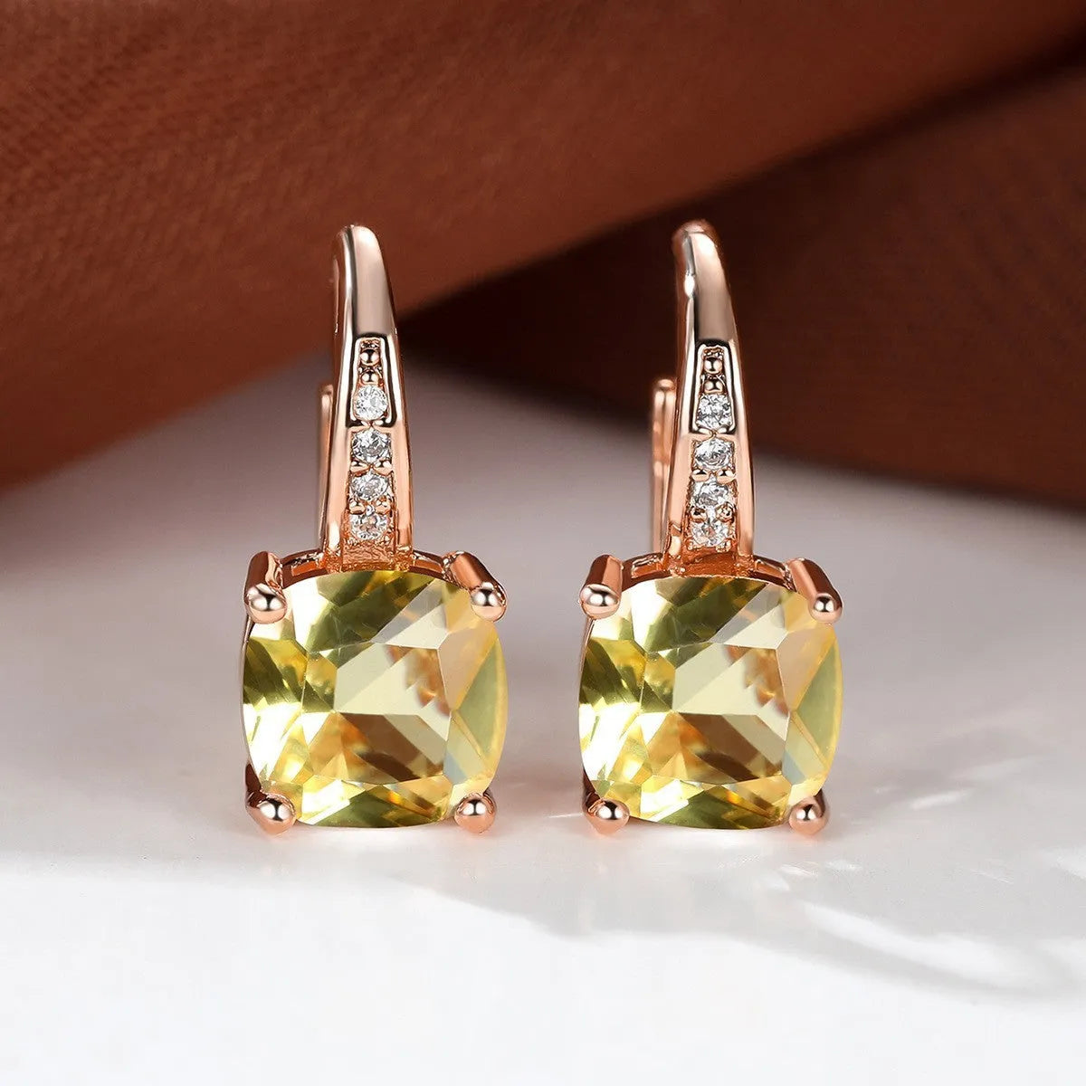 Square zircon inlaid ear hook earrings with geometric design and electroplated finish in golden tone
