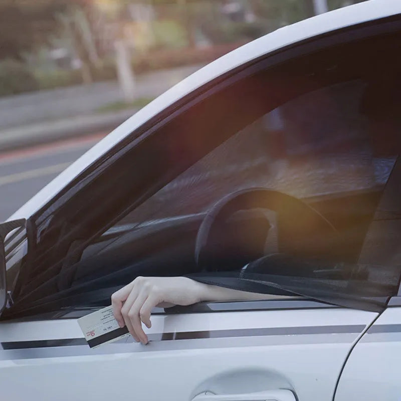 Stretch-fit mesh sunshades installed on a car's front and rear side windows for sun and insect protection.
