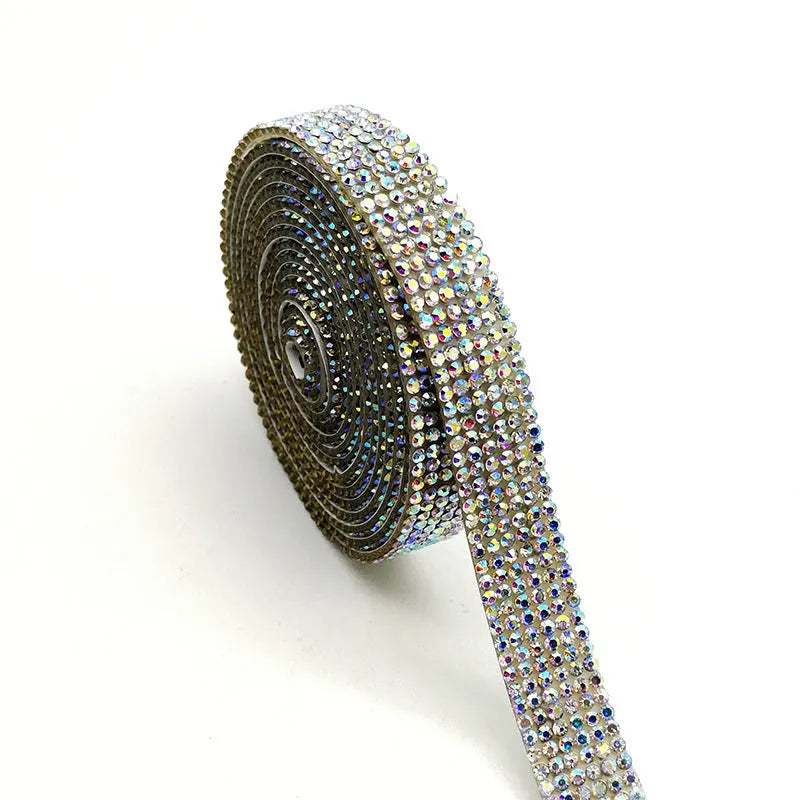 Long strip of electroplated glass water drill for fabric repair in white and iridescent AB colour, showing three width options.