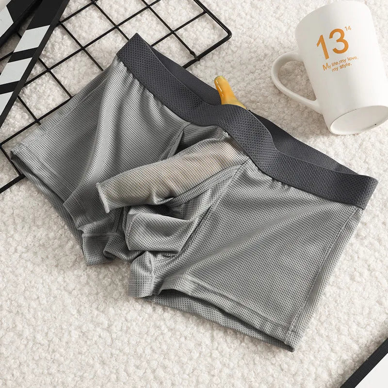 Men's ice silk boxer briefs in black, white, and grey colours showing mesh fabric and low-waist design