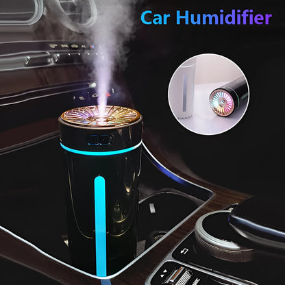Black wireless car humidifier with colourful LED lights shown in vehicle cup holder