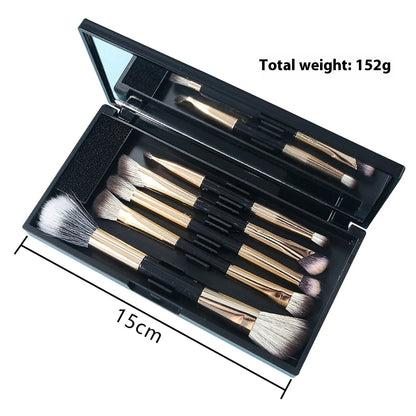 Makeup brush set with mirror compact case showing silver or gold brushes with artificial fibre bristles