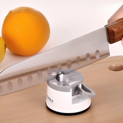 Fixed angle whetstone bar sharpener with tungsten steel slots and arrow indicators on mustard green ABS housing