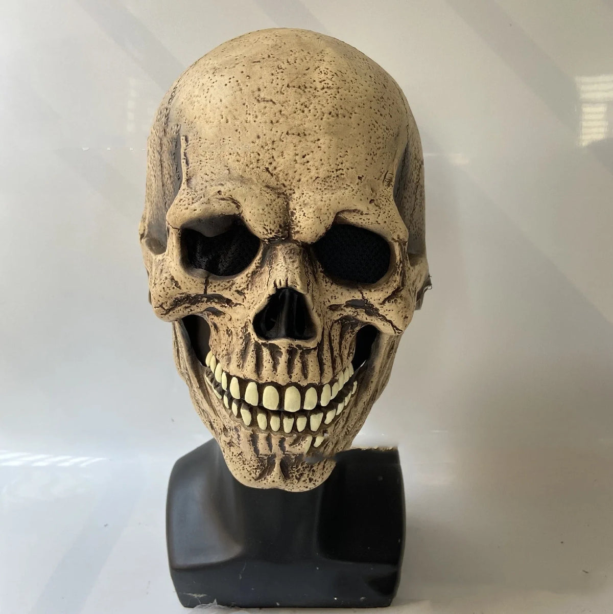 Halloween skull mask with movable jaw showing brain flower design in vinyl construction