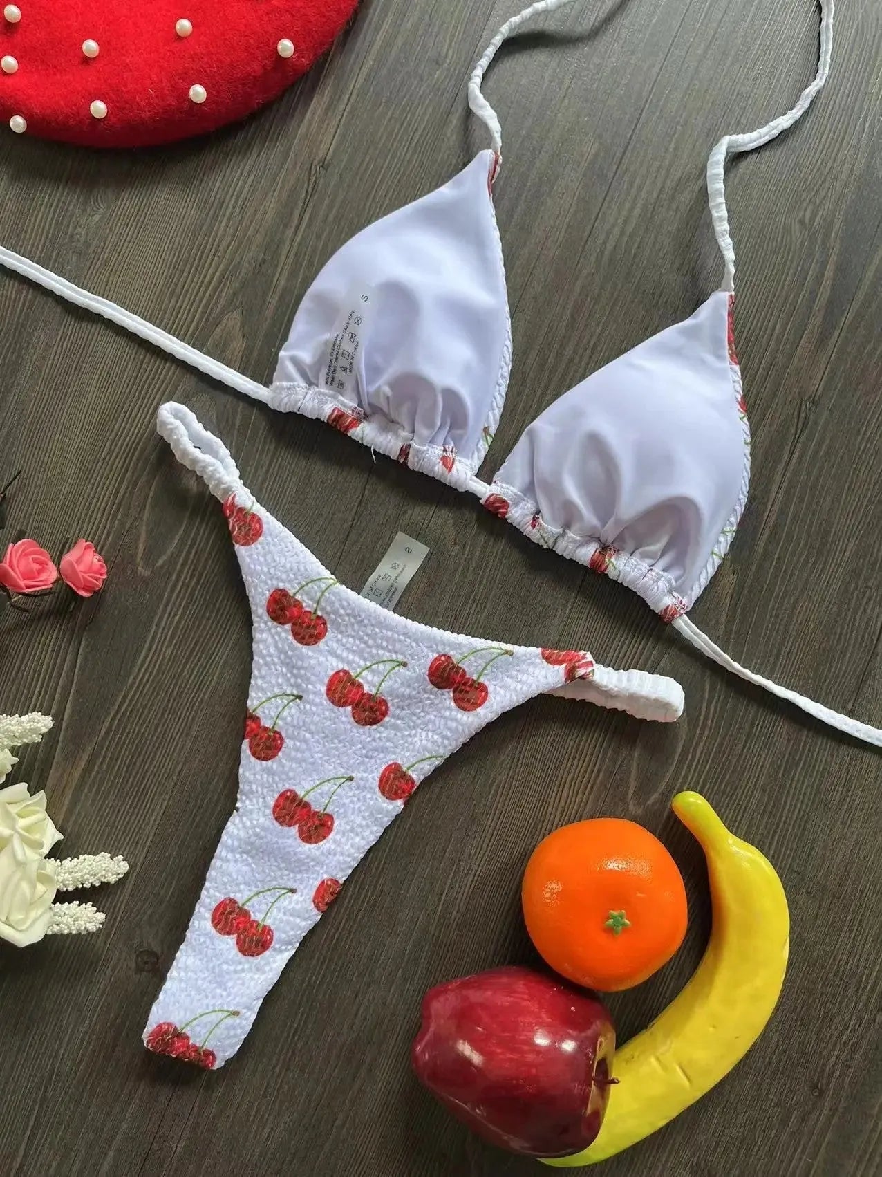 Women's printed bikini swimsuit with briefs style and cotton lining on a mannequin.