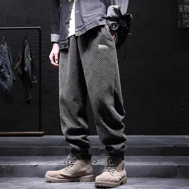Men's grey casual sweatpants with ankle-tie design and straight leg cut