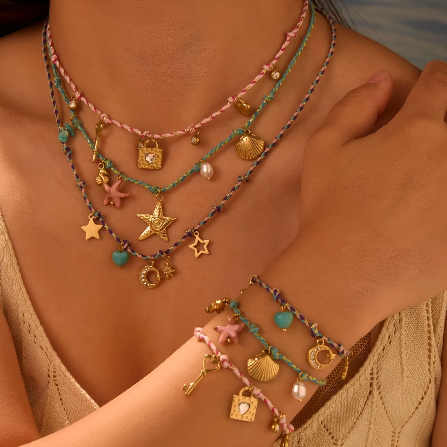 Handmade braided rope titanium steel necklace and bracelet with heart pendant on 18K gold plated chain.