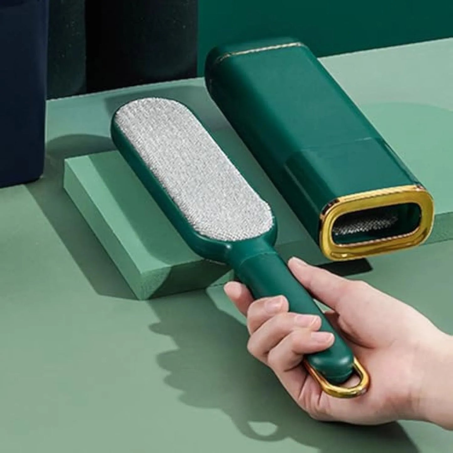 Double-sided pet hair remover brush in blue, green, or white for cleaning clothes and furniture