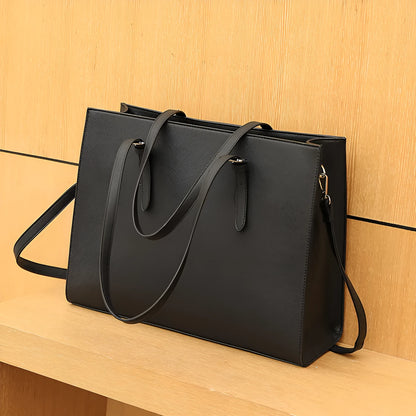 Black women's business computer bag with three shoulder straps showing internal organisation compartments