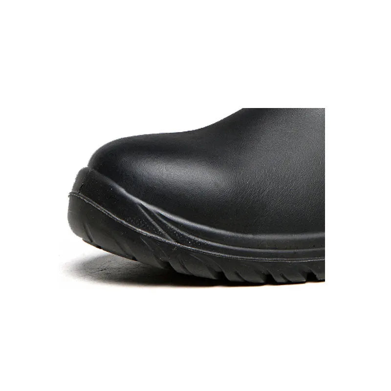 Black leather high-top safety work boots with anti-piercing sole on a worksite background.