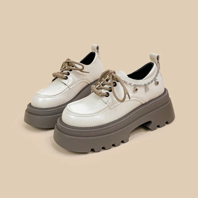 White women's platform Mary Jane shoes with a round toe and thick chunky heel.