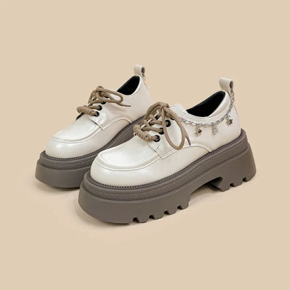 White women's platform Mary Jane shoes with a round toe and thick chunky heel.