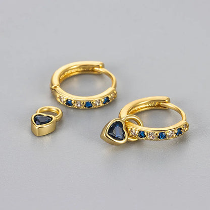 Fashion zircon earrings with 10mm heart-shaped drops in gold and white gold settings, showing diamond-treated stones