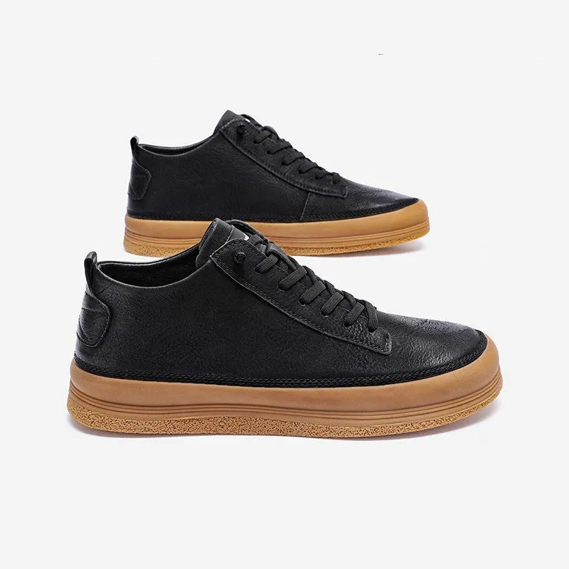 Men's black casual shoes with round toe, lanyard closure, and soft rubber soles on a neutral background