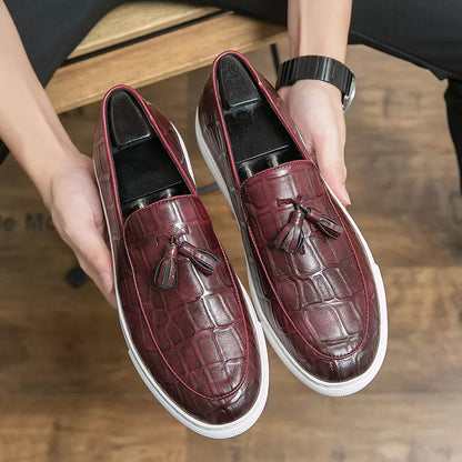 Men's business casual sneakers in black and wine red with leather-like finish and decorative tassels