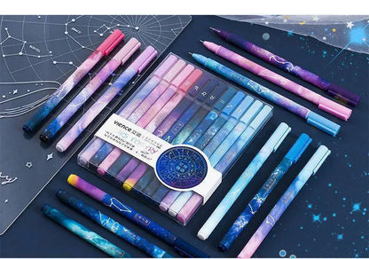 Twelve constellation ballpoint pens in a 12-piece plastic zodiac pen set with bright star designs.