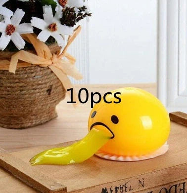 Gudetama Vomiting Egg Toy in green, orange, pink, and yellow for stress relief and fun